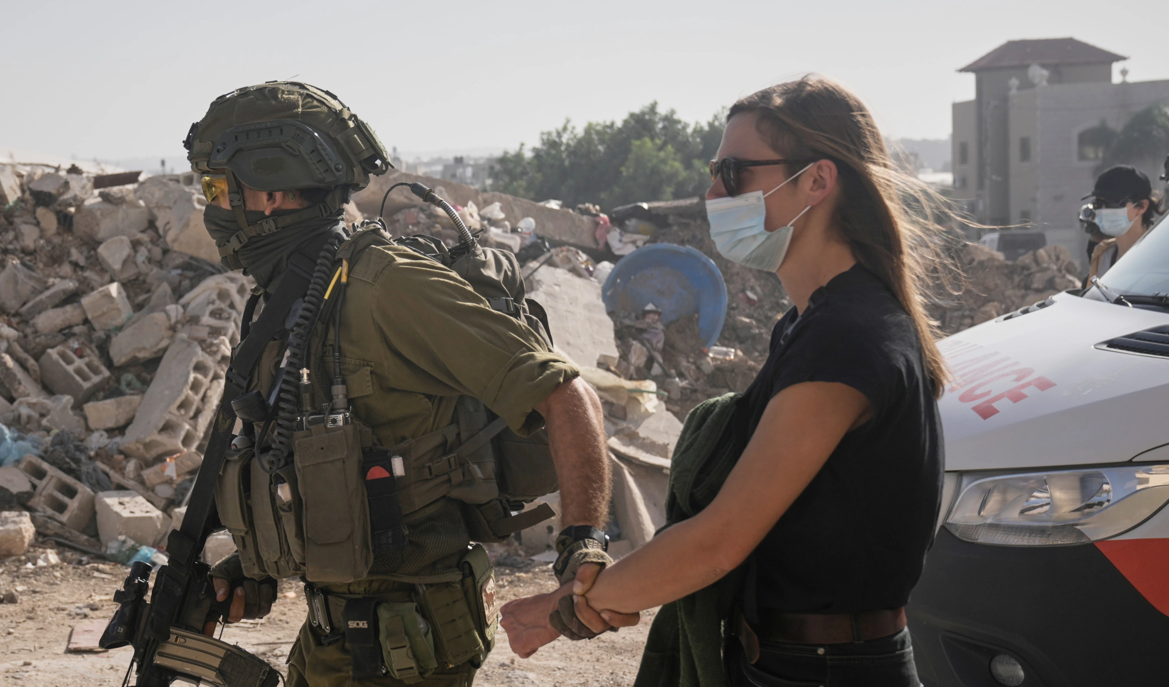 Israeli soldiers detain a demonstrator during a protest calling for the return of forcibly displaced Palestinians to their homes in the Nur Shams refugee camp, in the West Bank city of Tulkarem, Sunday, Nov. 23, 2025. (AP)