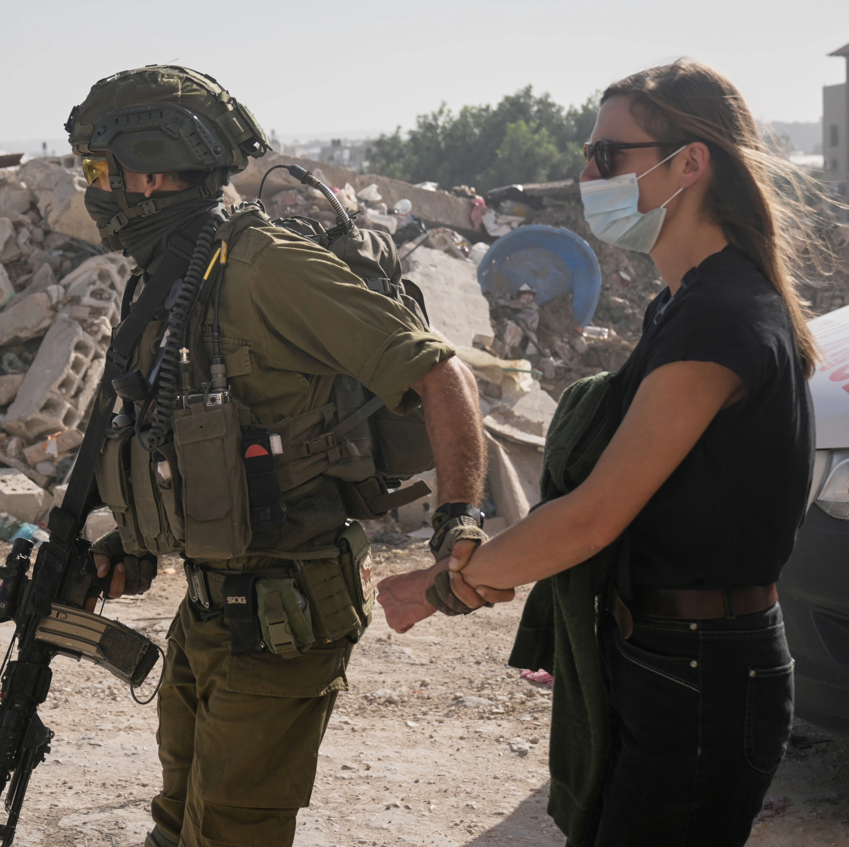 Israeli soldiers detain a demonstrator during a protest calling for the return of forcibly displaced Palestinians to their homes in the Nur Shams refugee camp, in the West Bank city of Tulkarem, Sunday, Nov. 23, 2025. (AP)