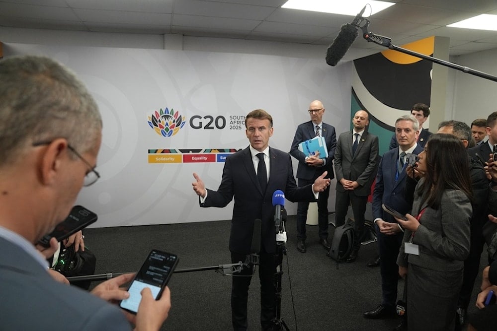 French President Emmanuel Macron speaks to the media at the end of the first day of the G20 leaders' summit in Johannesburg, South Africa, Saturday, Nov. 22, 2025. (AP Photo/Thibault Camus)