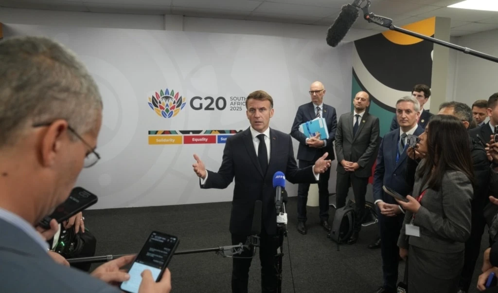 French President Emmanuel Macron speaks to the media at the end of the first day of the G20 leaders' summit in Johannesburg, South Africa, Saturday, Nov. 22, 2025. (AP Photo/Thibault Camus)