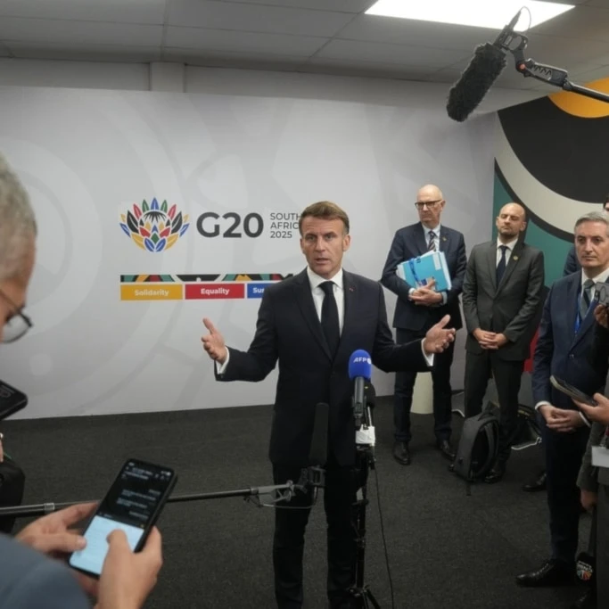 French President Emmanuel Macron speaks to the media at the end of the first day of the G20 leaders' summit in Johannesburg, South Africa, Saturday, Nov. 22, 2025. (AP Photo/Thibault Camus)