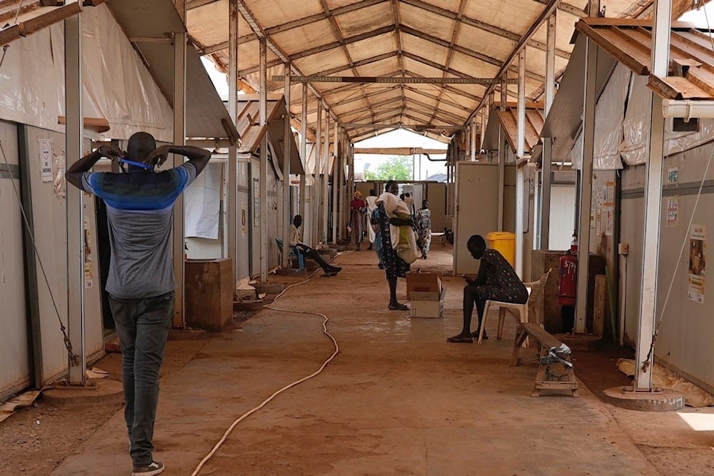 Patients and staff sit and walk around in the Doctors Without Borders-run hospital in Bentiu, South Sudan, Monday, June 24, 2024 (AP)