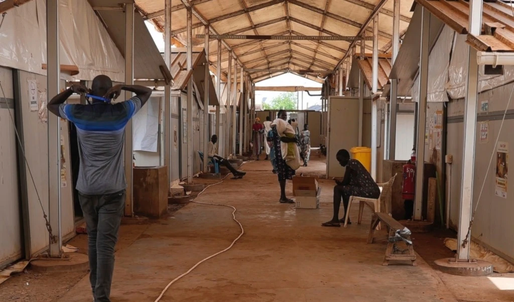 Patients and staff sit and walk around in the Doctors Without Borders-run hospital in Bentiu, South Sudan, Monday, June 24, 2024 (AP)