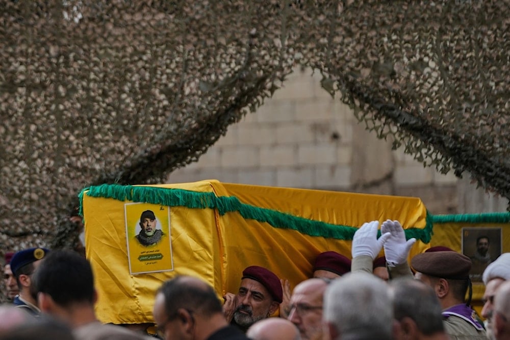 Hezbollah fighters carry the coffin of Hezbollah Chief of Staff Haytham Tabtabai during his funeral procession in the southern suburb of Beirut, Lebanon, Monday, November 24, 2025 (AP)