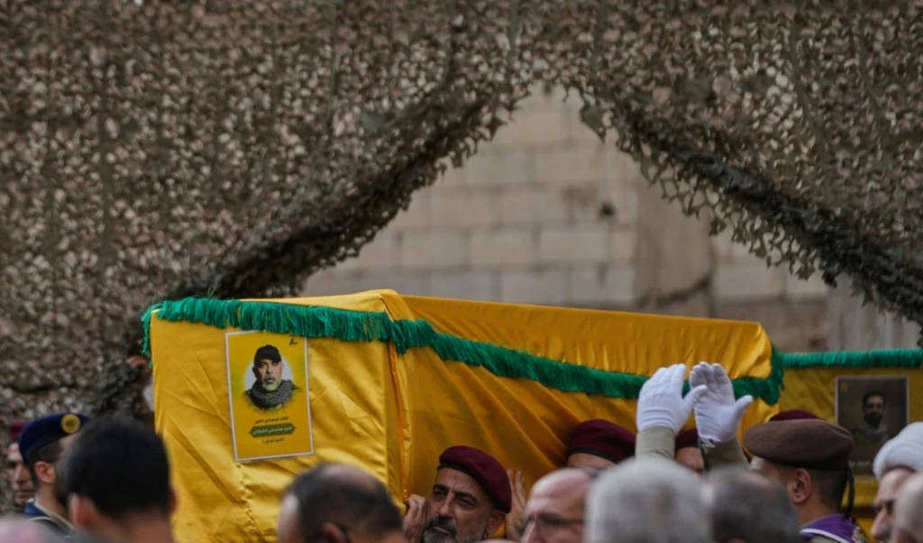 Hezbollah fighters carry the coffin of Hezbollah Chief of Staff Haytham Tabtabai during his funeral procession in the southern suburb of Beirut, Lebanon, Monday, November 24, 2025 (AP)