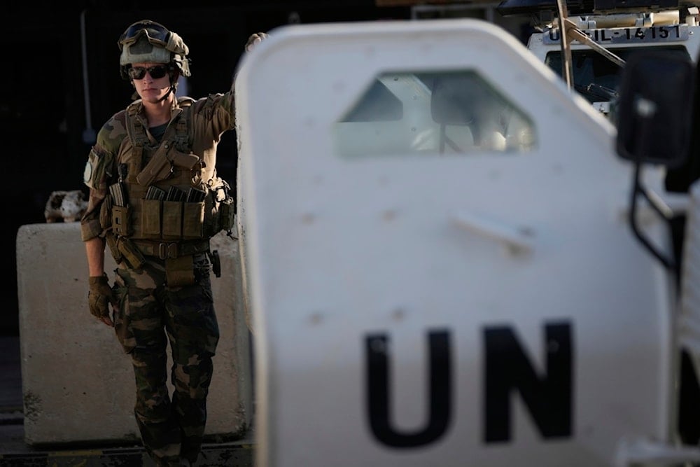 A French UN peacekeeper stands beside an armored vehicle at his base, waiting to move with his unit for a patrol along the Lebanese-Israeli border in Deir Kifa, southern Lebanon, Wednesday, August 20, 2025 (AP)