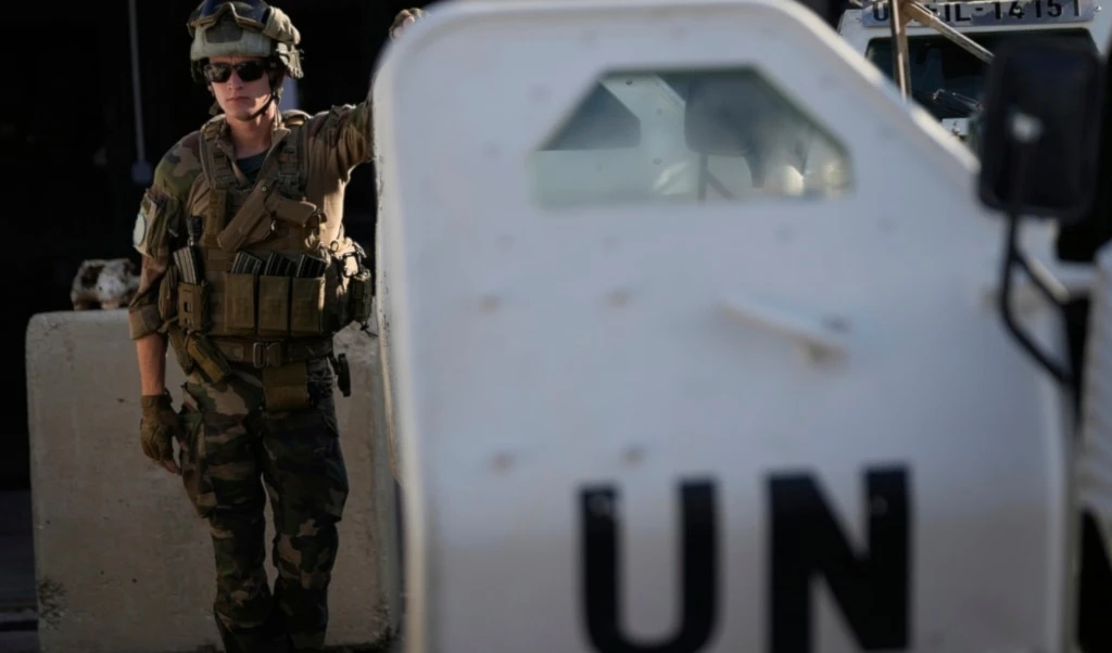 A French UN peacekeeper stands beside an armored vehicle at his base, waiting to move with his unit for a patrol along the Lebanese-Israeli border in Deir Kifa, southern Lebanon, Wednesday, August 20, 2025 (AP)