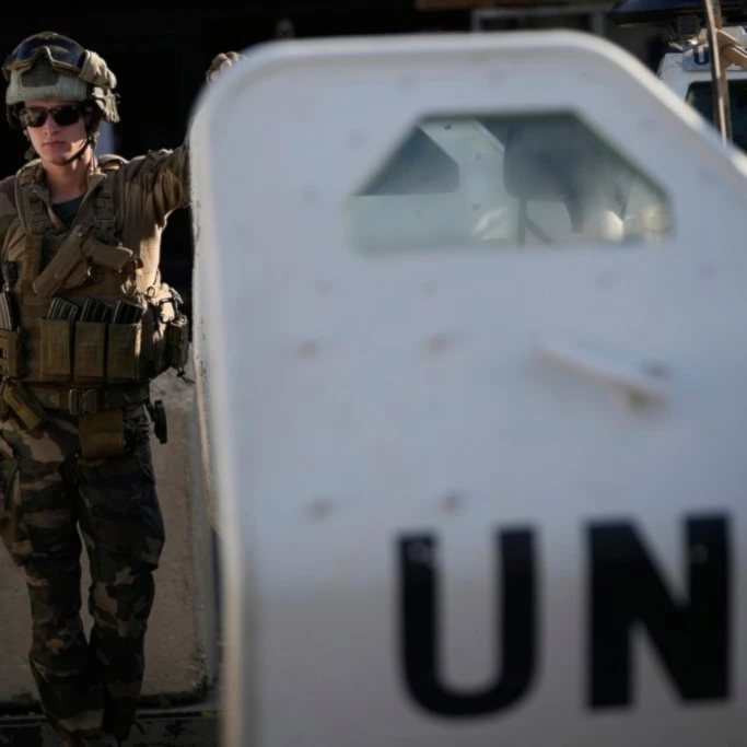A French UN peacekeeper stands beside an armored vehicle at his base, waiting to move with his unit for a patrol along the Lebanese-Israeli border in Deir Kifa, southern Lebanon, Wednesday, August 20, 2025 (AP)