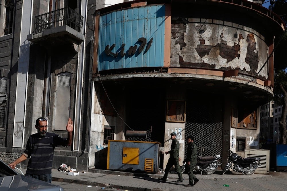 People walk through a street in the old city of Homs, Syria, Friday, November 21, 2025 (AP)
