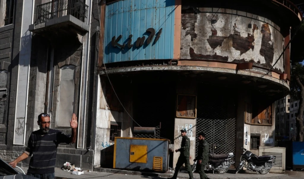 People walk through a street in the old city of Homs, Syria, Friday, November 21, 2025 (AP)