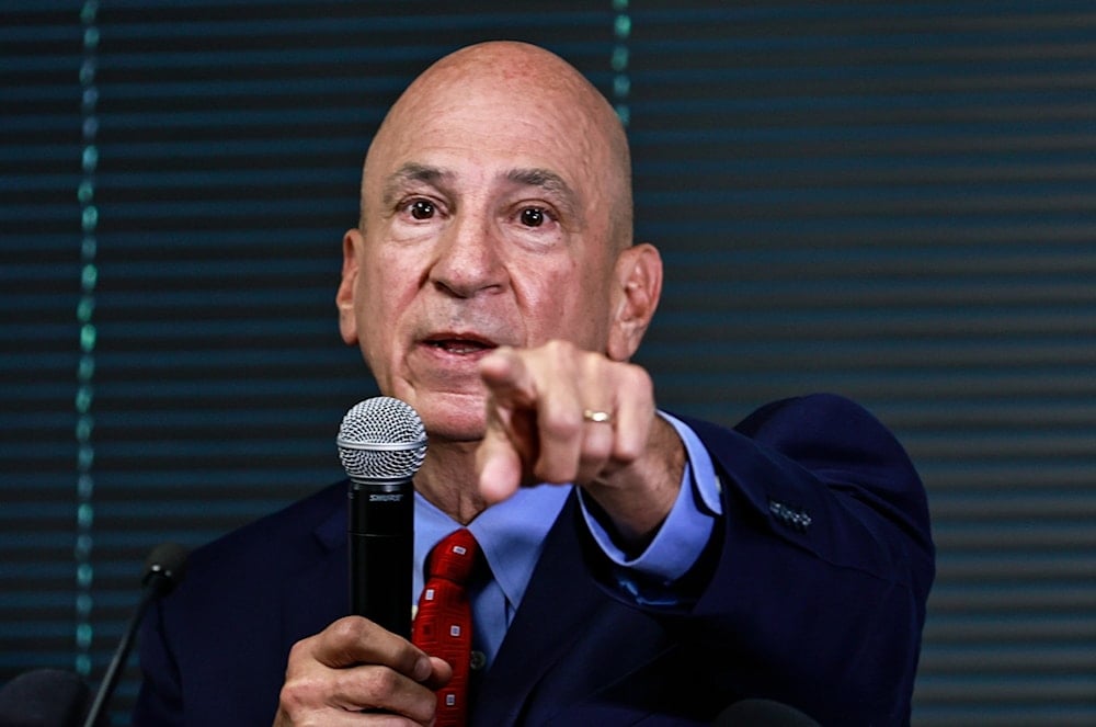 Peter J. Skandalakis speaks during a press briefing, pointing toward attendees while addressing questions about the Georgia election-interference case.