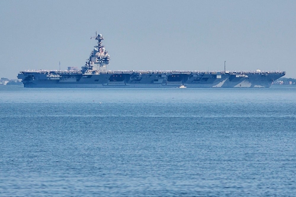 FILE The USS Gerald R. Ford aircraft carrier leaves Naval Station Norfolk, June 23, 2025, in Norfolk, Va. (AP Photo/John Clark, File)