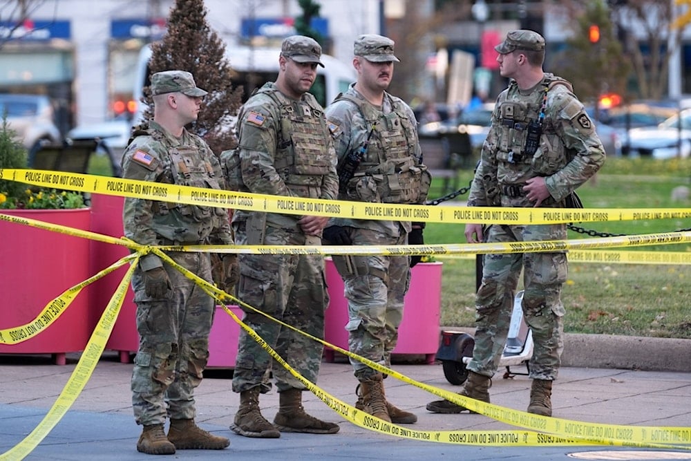 National Guard members are seen after reports of two National Guard soldiers shot near the White House in Washington, Wednesday, November 26, 2025 (AP)