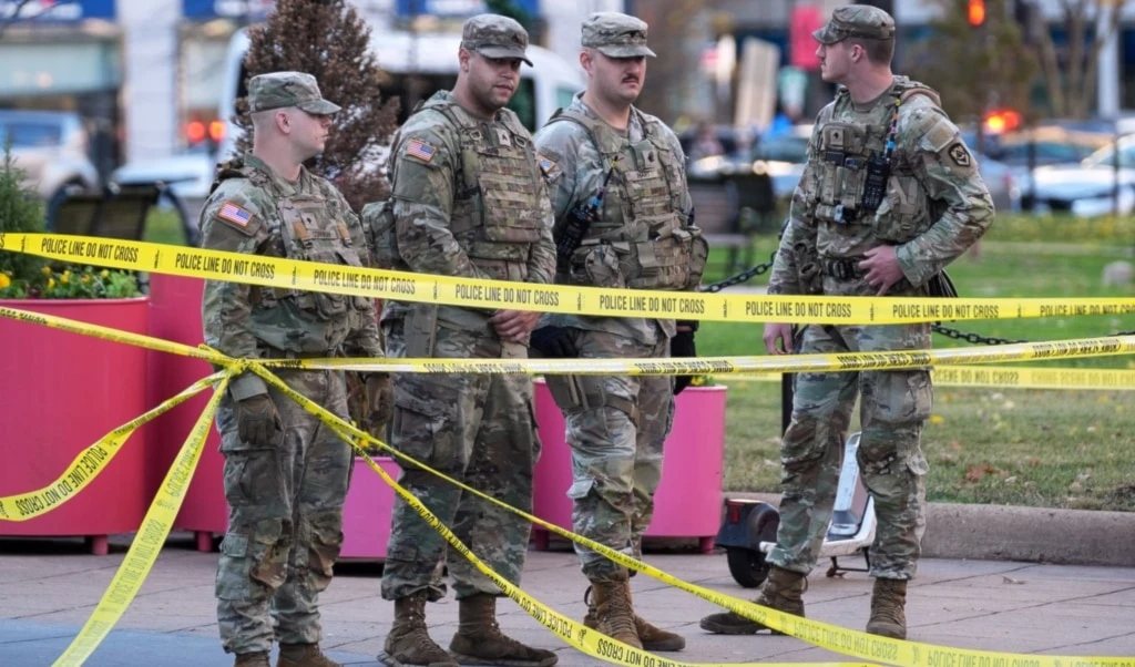 National Guard members are seen after reports of two National Guard soldiers shot near the White House in Washington, Wednesday, November 26, 2025 (AP)