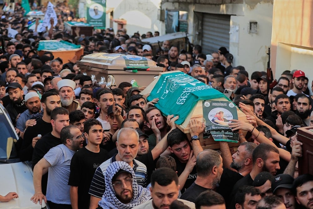 Mourners carry coffins of the victims of Tuesday's Israeli airstrike, during a funeral procession in the Ain el-Hilweh Palestinian refugee camp, in the southern port city of Sidon, Lebanon, Thursday, November 20, 2025 (AP)