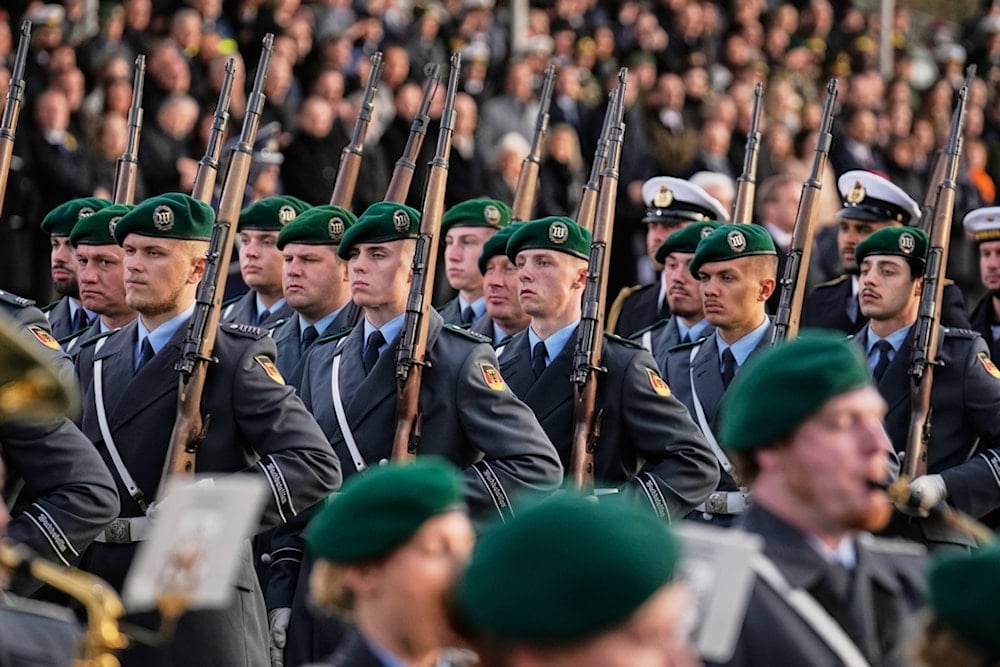Soldiers take part in the ceremonial pledge as a central event to mark the 70th anniversary of the Bundeswehr German army) in Berlin, Germany, Wednesday, Nov.12, 2025. (AP Photo/Ebrahim Noroozi)