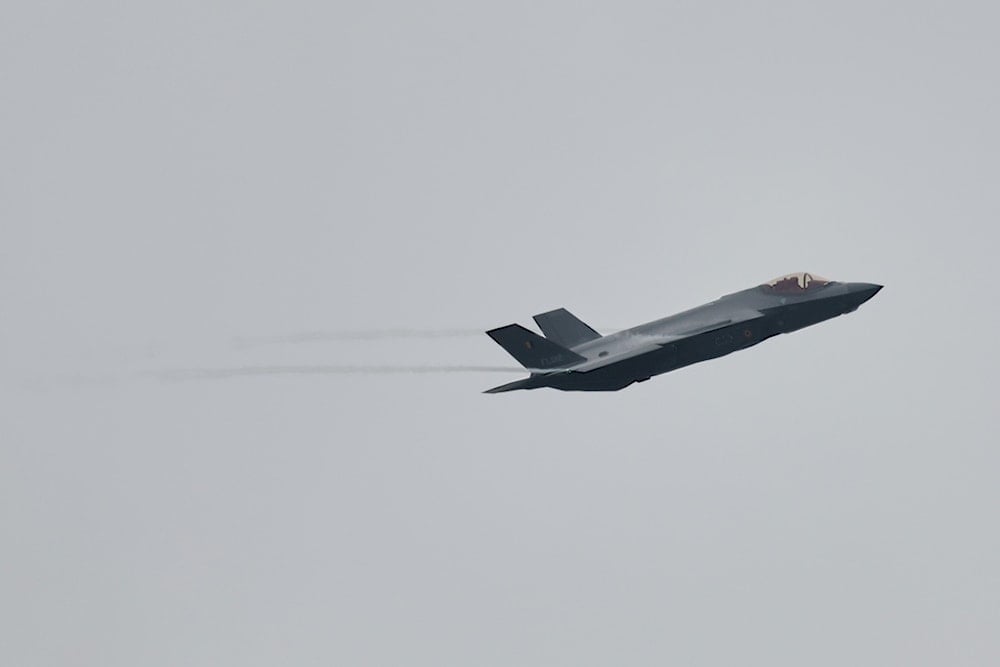 An F-35A Lightning II flys by on the occassion of the first F-35 fighter jets arriving at the Florennes Airbase in Florennes, Belgium, Monday, Oct. 13, 2025 (AP Photo/Geert Vanden Wijngaert)