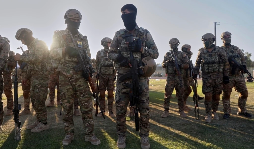 Fighters from the US-backed Syrian Democratic Forces (SDF) prepare to attend a military parade in Qamishli, northeastern Syria, Tuesday, August 12, 2025 (AP)