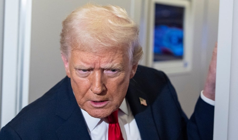 President Donald Trump leans in to hear a question as he speaks with reporters while in flight on Air Force One, Nov. 25, 2025. (AP)