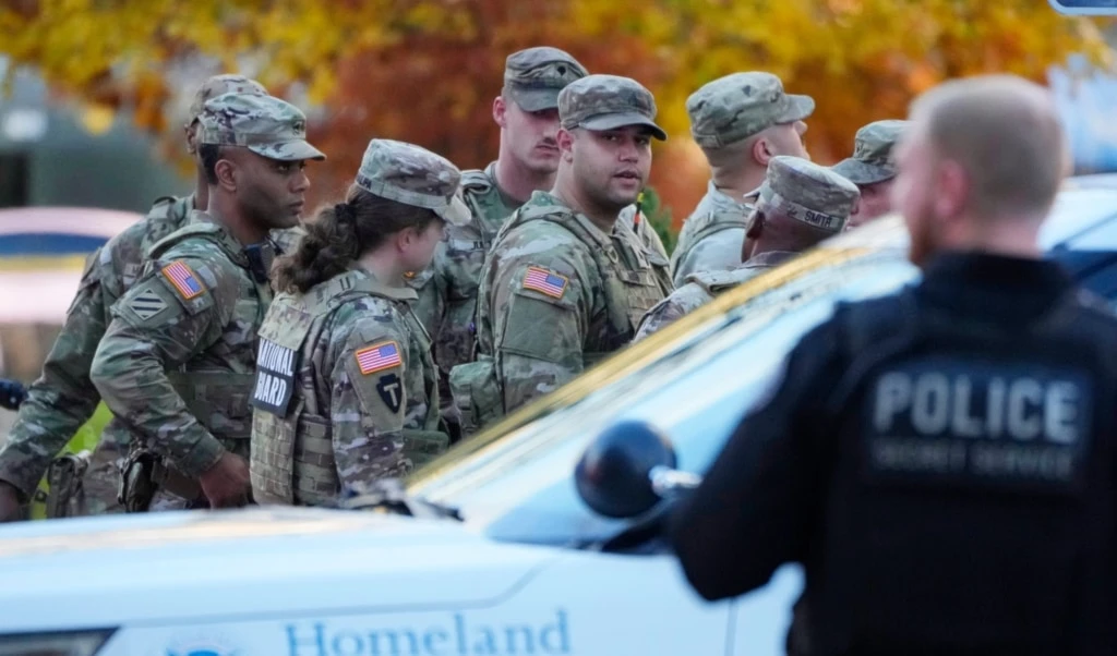 Members of the National Guard gather after reports of two National Guard soldiers were shot near the White House in Washington, Nov. 26, 2025. (AP)