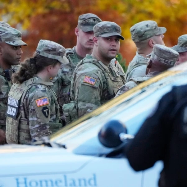 Members of the National Guard gather after reports of two National Guard soldiers were shot near the White House in Washington, Nov. 26, 2025. (AP)