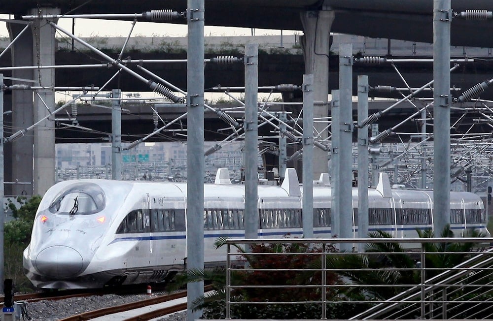 A China train collision kills 11 railway workers in a test run in Yunnan.