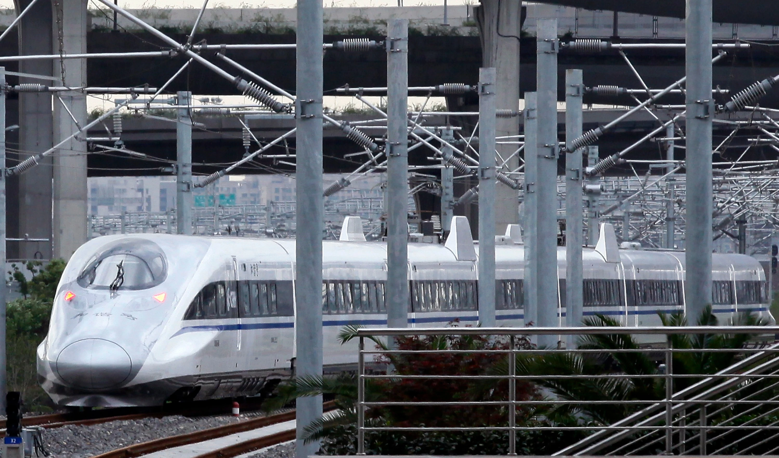 A China train collision kills 11 railway workers in a test run in Yunnan.