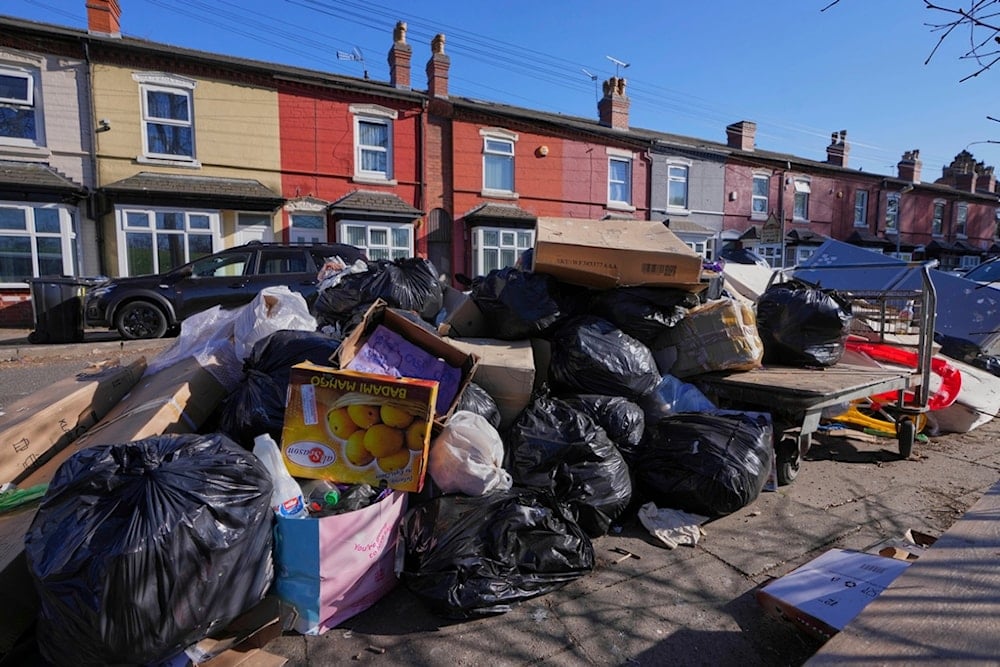 Rubbish piles up on a residential street in Birmingham, England, Monday, April 7, 2025, amid an ongoing refuse workers' strike in the city. (AP Photo/Kirsty Wigglesworth)