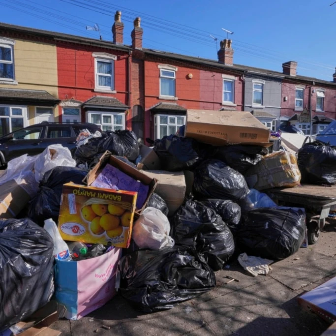 Rubbish piles up on a residential street in Birmingham, England, Monday, April 7, 2025, amid an ongoing refuse workers' strike in the city. (AP Photo/Kirsty Wigglesworth)