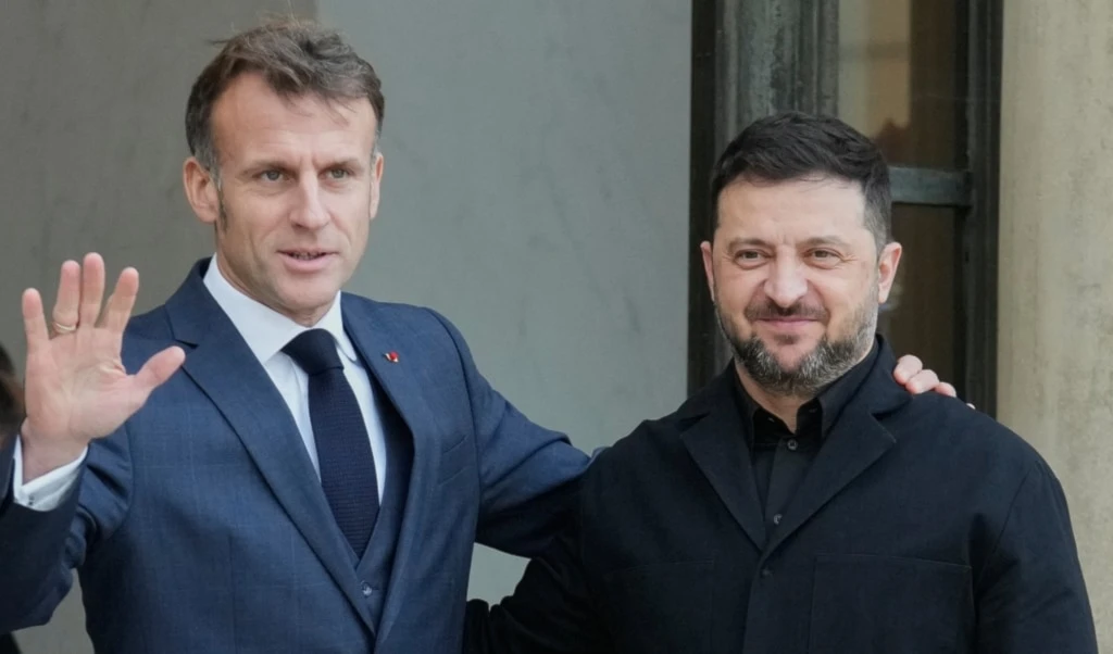 French President Emmanuel Macron, left, welcomes Ukrainian President Volodymyr Zelenskyy, Monday, Nov. 17, 2025 before a joint press conference at the Elysee Palace in Paris. (AP)