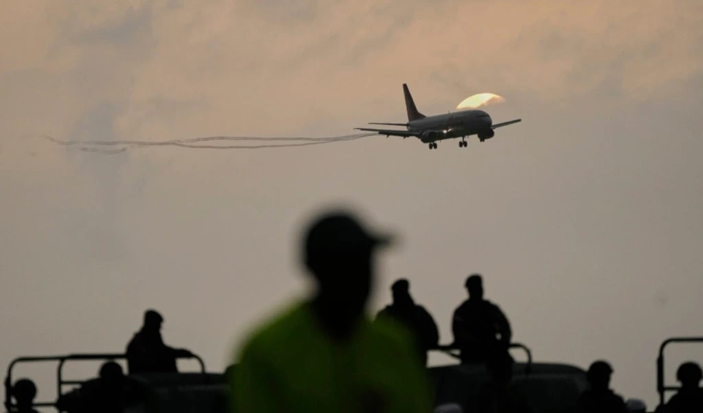 A plane carrying migrants deported months ago by the United States to El Salvador under the Trump administration's immigration crackdown lands at Simón Bolívar International Airport in Maiquetía, Venezuela, July 18, 2025. (AP)