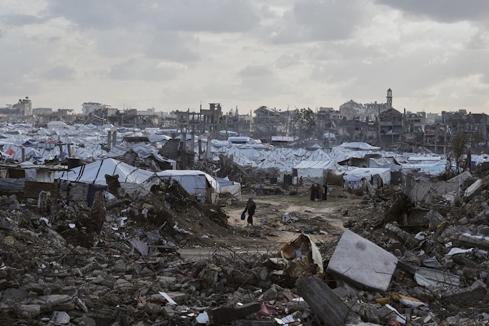 A tent camp for displaced Palestinians stands amid the destruction left by Israeli strikes north of Gaza City, Tuesday, November 25, 2025 (AP)
