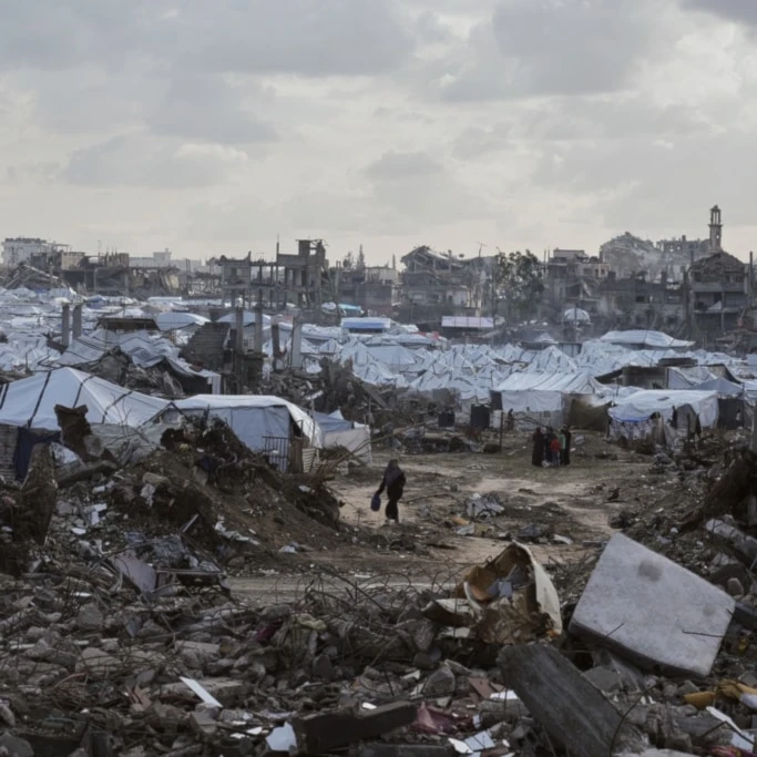 A tent camp for displaced Palestinians stands amid the destruction left by Israeli strikes north of Gaza City, Tuesday, November 25, 2025 (AP)