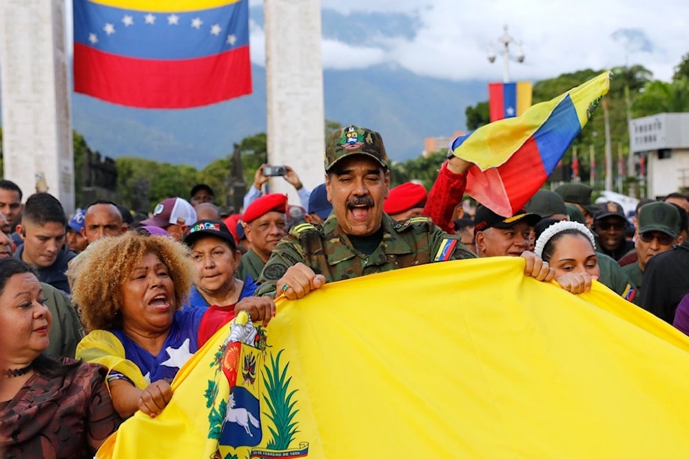 Venezuelan President Nicolas Maduro takes part in a government-organized civic-military rally in Caracas, Venezuela, Tuesday, Nov. 25, 2025. (AP Photo/Cristian Hernandez)