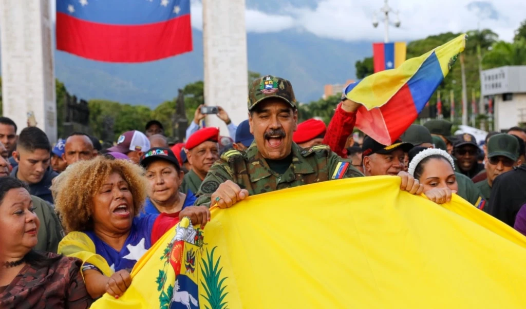 Venezuelan President Nicolas Maduro takes part in a government-organized civic-military rally in Caracas, Venezuela, Tuesday, Nov. 25, 2025. (AP Photo/Cristian Hernandez)