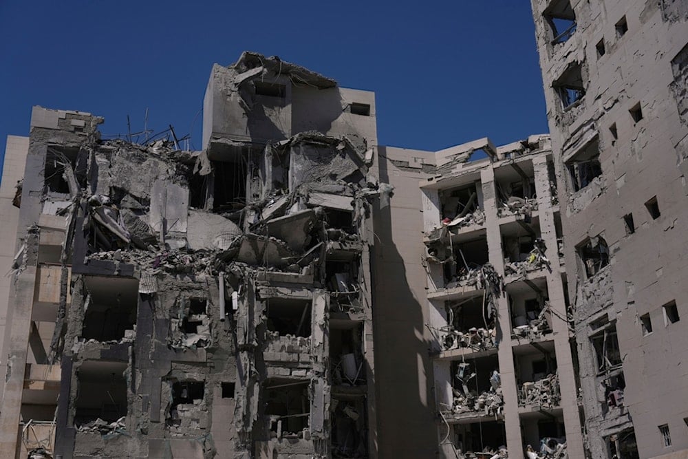 A heavily damaged building stands after a direct missile strike, launched from Iran, following the announcement of a ceasefire, in Beer al-Sabe, occupied Palestine, Wednesday, June 25, 2025 (AP)