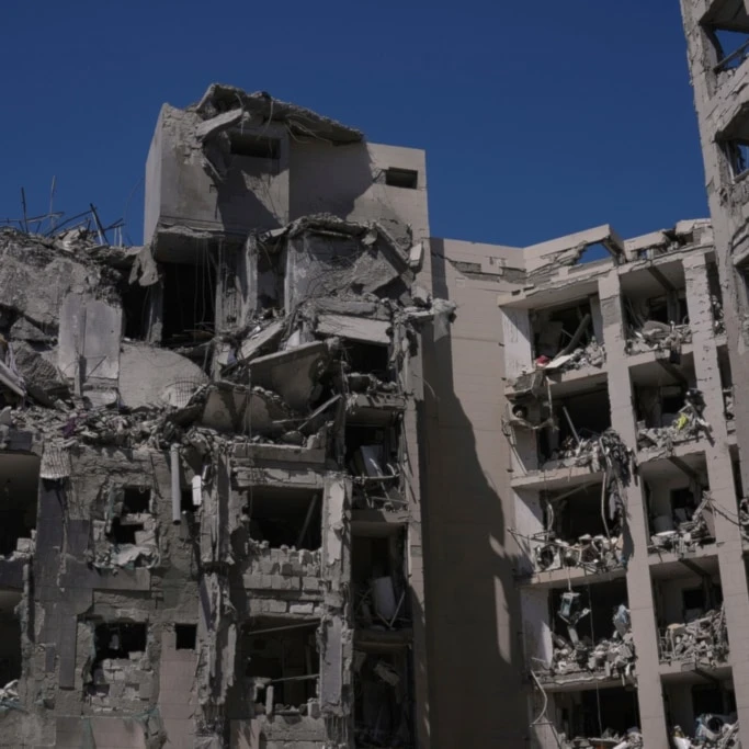 A heavily damaged building stands after a direct missile strike, launched from Iran, following the announcement of a ceasefire, in Beer al-Sabe, occupied Palestine, Wednesday, June 25, 2025 (AP)