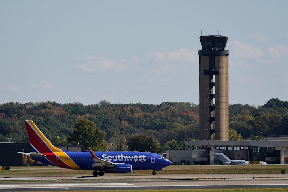 US airports are hit by widespread delays, as the shutdown strains air traffic.