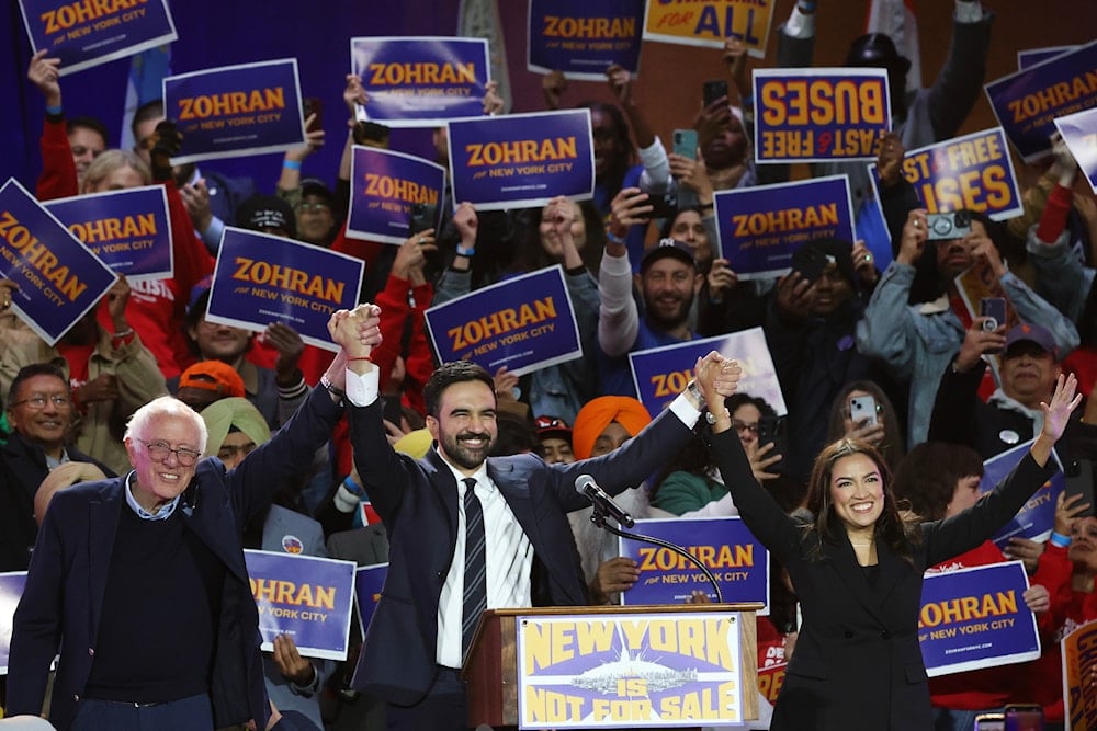 Sen. Bernie Sanders, I-Vt., left, New York City mayoral candidate Zohran Mamdani, center, and Rep. Alexandria Ocasio-Cortez, D-N.Y., appear on stage during a rally, Sunday, Oct. 26, 2025, in New York (AP)