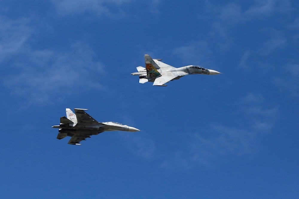 Fighter jets fly over during the industrial aviation expo at Libertador Air Base in Maracay, Venezuela, Saturday, November 29, 2025 (AP)