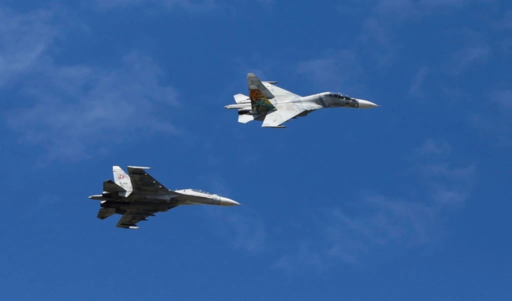 Fighter jets fly over during the industrial aviation expo at Libertador Air Base in Maracay, Venezuela, Saturday, November 29, 2025 (AP)