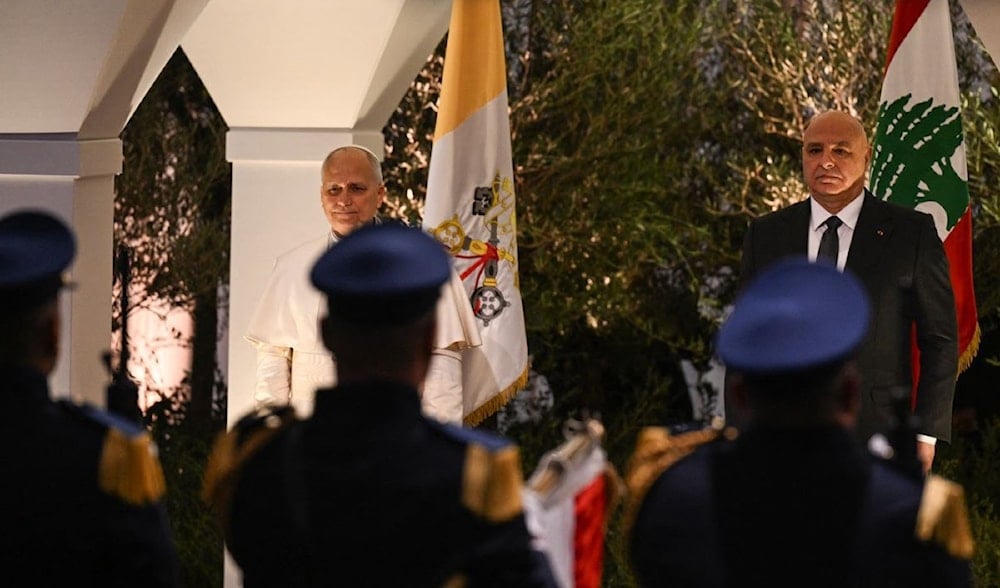 Pope Leo XIV (L) stands next to Lebanon's President Joseph Aoun during a welcome ceremony upon arriving at Beirut International Airport, in the Lebanese capital, on November 30, 2025. (AFP)