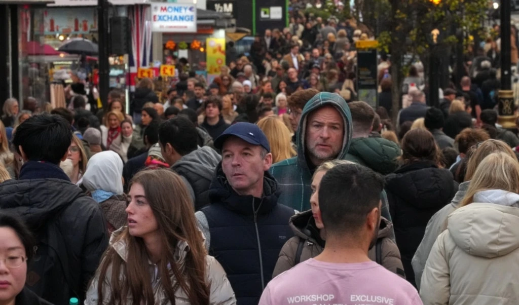 Shoppers walk along London's most famous shopping Street, Oxford Street, in London, the United Kingdom, Friday, November 28, 2025 (AP)