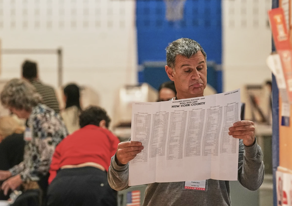 Workers prepare for voters at a poll site in New York on November 4, 2025. (AP)