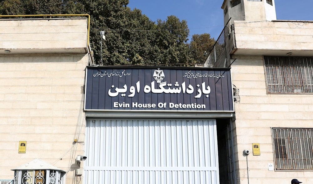 A guard stands outside Evin Prison in Tehran, Iran, 2022 (AFP)