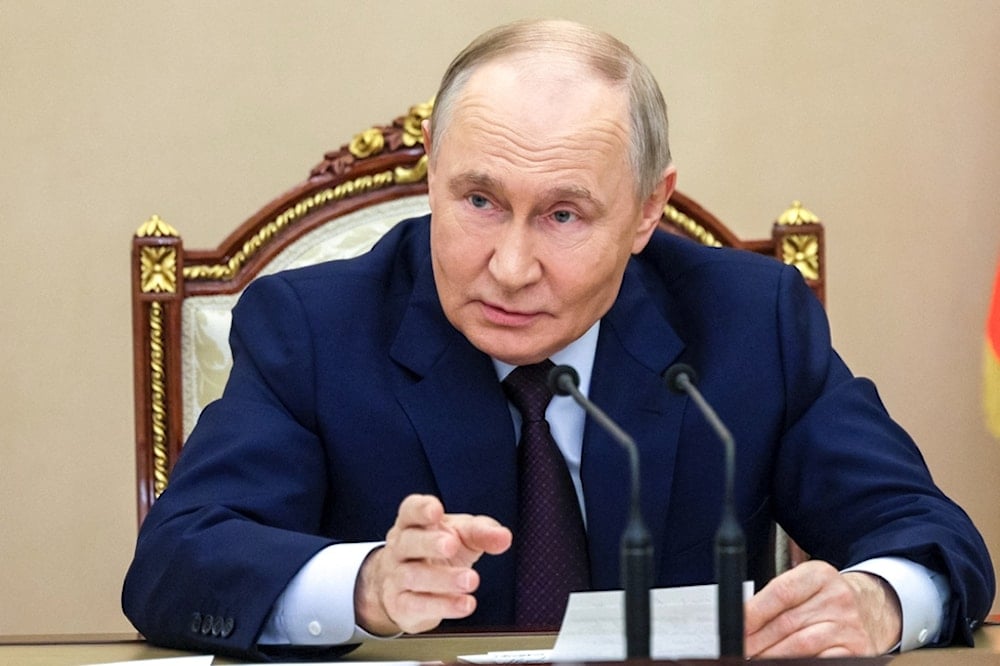 Russian President Vladimir Putin chairs a meeting with members of the Security Council in Moscow, Russia, Wednesday, November 5, 2025. (Gavriil Grigorov, Sputnik, Kremlin Pool Photo via AP)