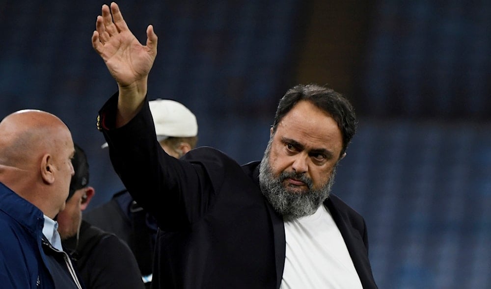 Evangelos Marinakis walks on the pitch at the end of the Europa Conference League semifinal, first leg, soccer match between Aston Villa and Olympiacos at Villa Park in Birmingham, England, May 2, 2024. (AP)