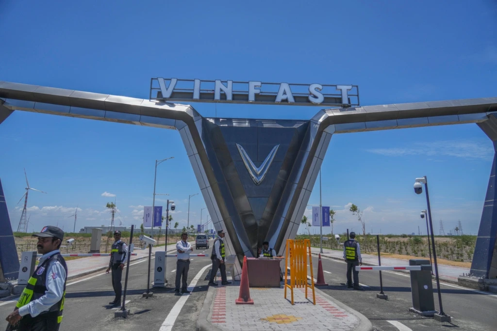 Private security stand guard at the entrance of the VinFast electric vehicle plant in Thoothukudi, in the southern Indian state of Tamil Nadu, Monday, Aug. 4, 2025. (AP Photo/Rafiq Maqbool)