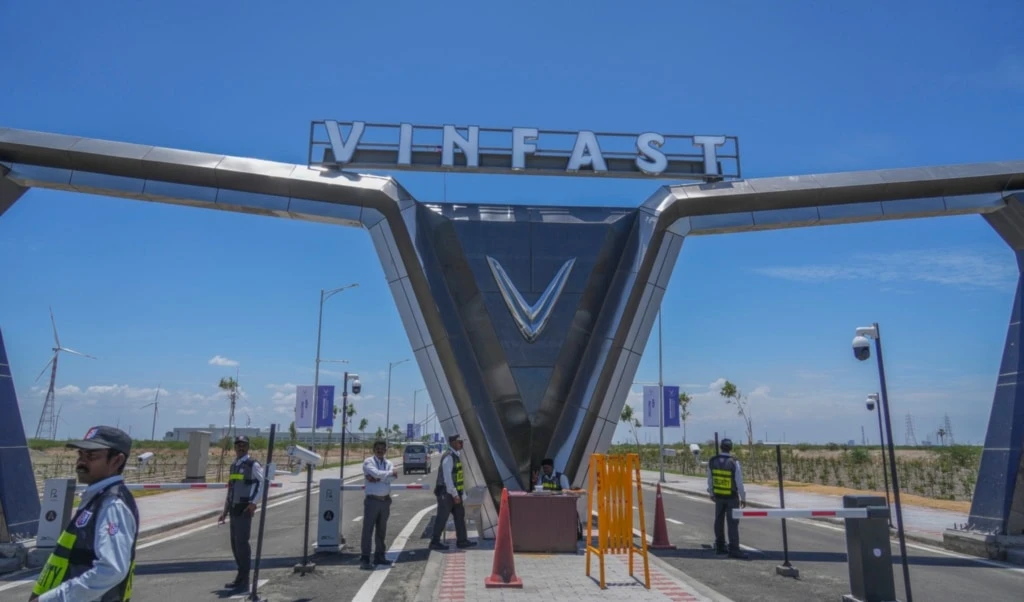 Private security stand guard at the entrance of the VinFast electric vehicle plant in Thoothukudi, in the southern Indian state of Tamil Nadu, Monday, Aug. 4, 2025. (AP Photo/Rafiq Maqbool)