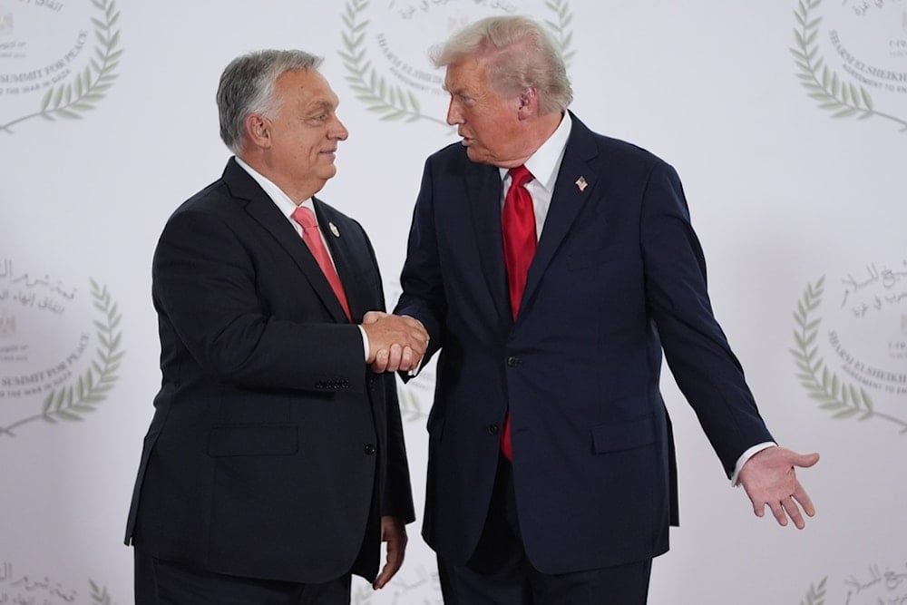 President Donald Trump greets Hungary's Prime Minister Viktor Orban during a summit to support ending the more than two-year genocide in Gaza, Monday, October 13, 2025, in Sharm El Sheikh, Egypt (AP)